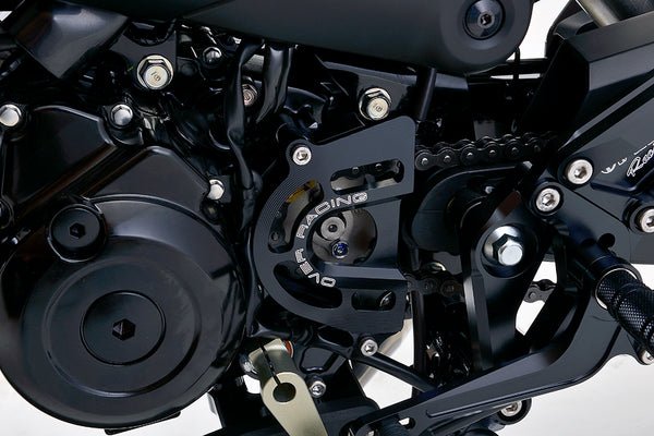 OVER Racing Sprocket Cover with Shift Shaft Support Black GROM(21-)/Monkey125(21-)/DAX125(22-23)(24-) | 57-223-11B image 1