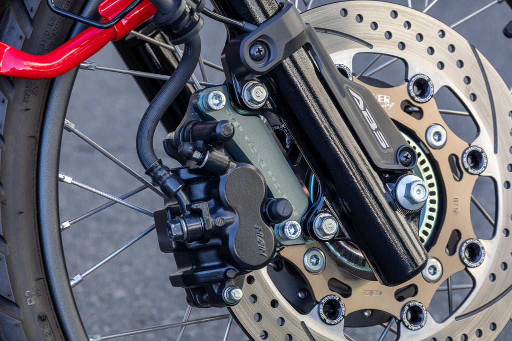OVER Racing Caliper Bracket for Oversize Rotor Gunmetal CT125(20-22)(23-) | 83-06-11GM image 1