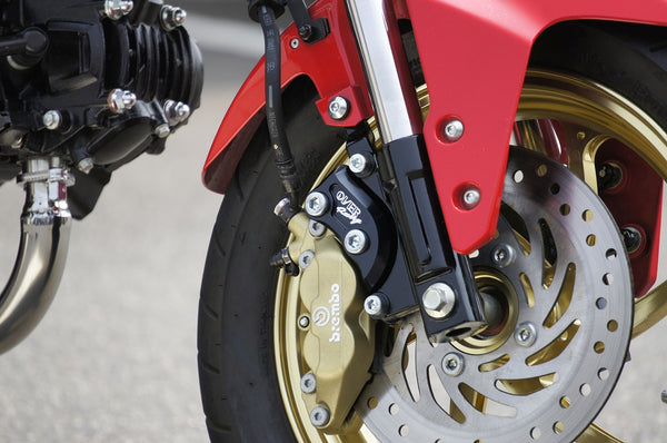 OVER Racing Front Caliper Bracket Black Brembo 4-Piston OVER/SUNSTAR for GROM | 83-22-13 image 1