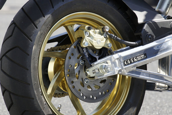 OVER Racing Rear Caliper Bracket Black Brembo 2-Piston for Upper Mount GROM | 83-22-21 image 1
