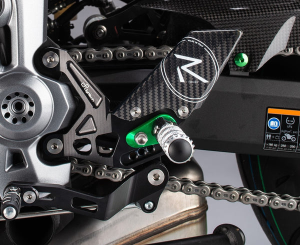LighTech FTR704VER green footpeg holder shown installed on an R-version rearset; holder only, rearset, footpeg, motorcycle and other accessories are not included.