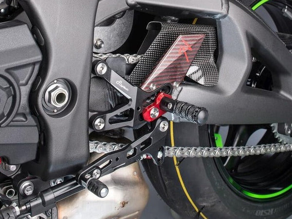 LighTech FTRKA006R R-version rearsets installed, shift-side detail; black footpegs pictured; motorcycle and other accessories not included.