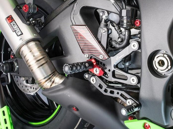 LighTech FTRKA006R R-version rearsets installed, brake-side angle; black footpegs pictured; motorcycle and other accessories not included.