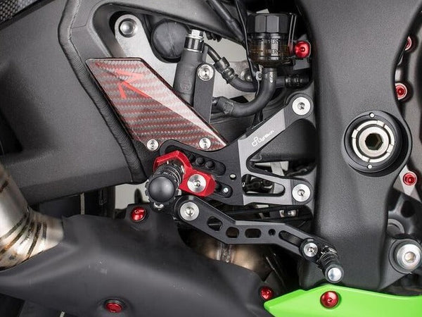 LighTech FTRKA006R R-version rearsets installed, brake-side detail; black footpegs pictured; motorcycle and other accessories not included.