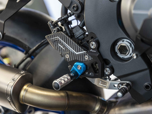 LighTech FTRYA023R installed on Yamaha R9; blue optional footpeg holders shown