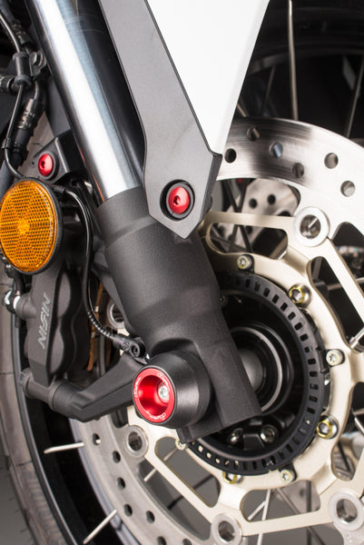 LighTech WAPHO406ROS red front axle slider installed, wider fork view; paddock stand, stand supports, chain adjusters, chain guard, coloured fasteners and motorcycle accessories are not included.