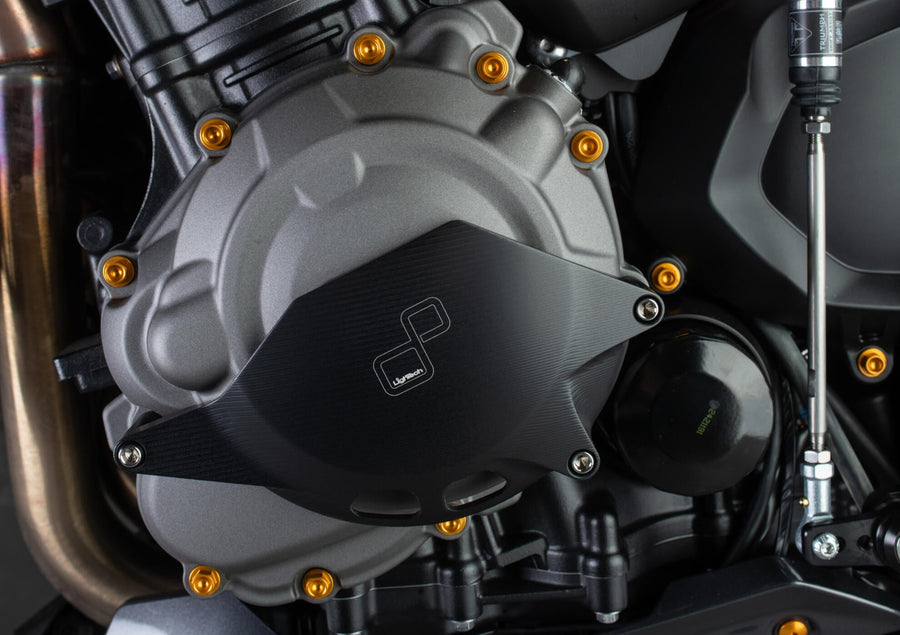LighTech ECPTR004NER left engine cover protector - black installed view; other accessories are separate.