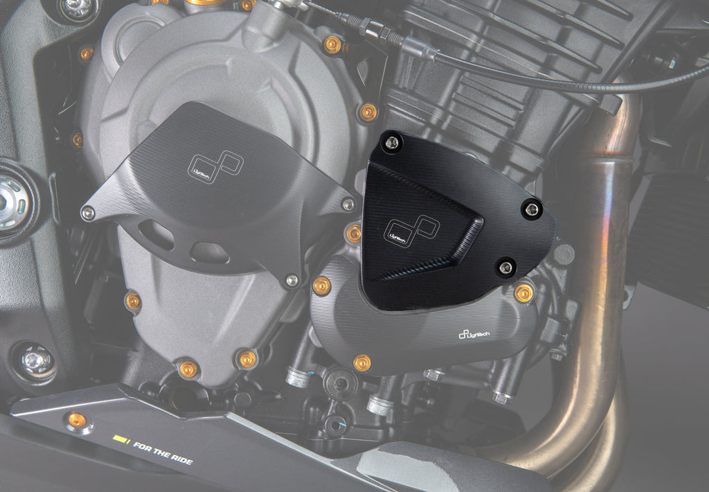 LighTech ECPTR005NER upper right pick-up cover protector - black. Installed view highlights the upper cover protector. The clutch cover protector, lower cover protector, coloured bolts and motorcycle are separate.