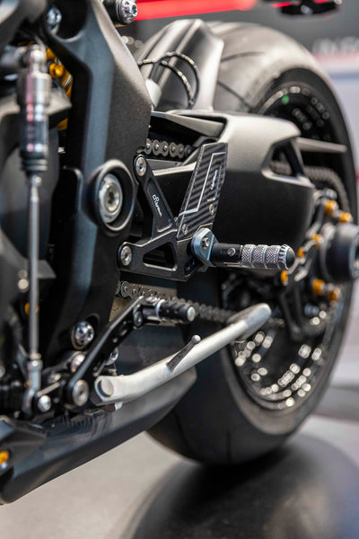 LighTech FTRTR007R R Version rearsets, left-side installed view. Grey footpeg holder is optional; standard holders are red. Motorcycle and other accessories are separate.