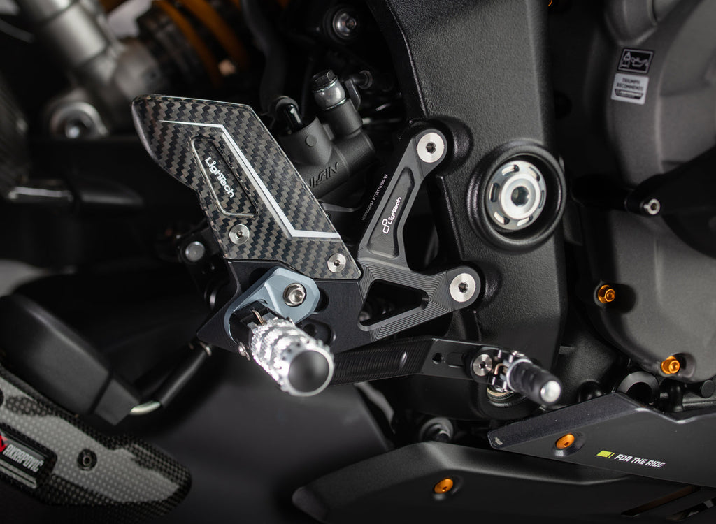LighTech FTRTR007R r version adjustable rearsets. Installed photograph shows optional grey footpeg holders, which are not included as standard. The motorcycle, exhaust and other accessories are separate.