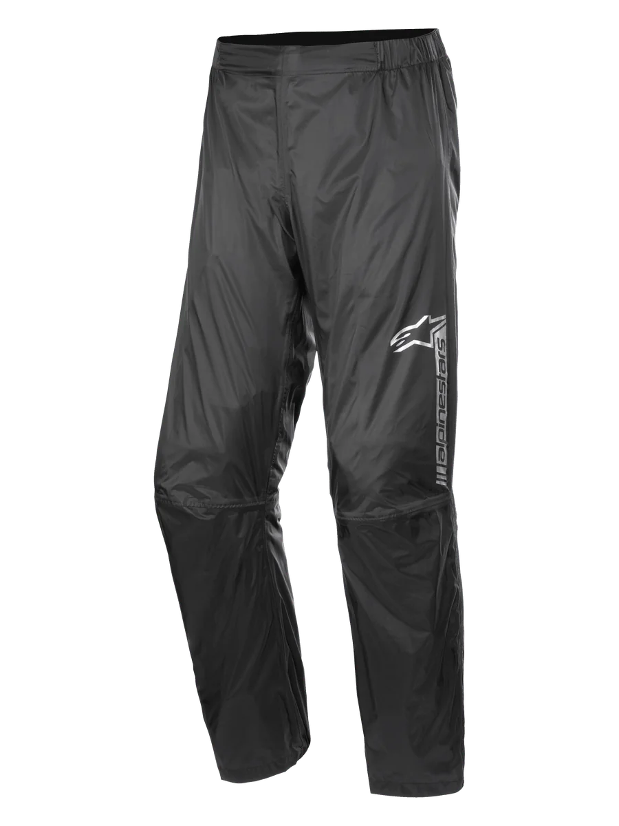 Alpinestars Hurricane Rain V2 Pant, Waterproof Motorcycle Rain Pants, Black, featuring reflective branding on the left thigh, elasticated waistband, ergonomic knee design, and shiny wind-resistant laminated fabric for road and adventure touring