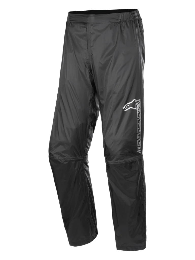 Alpinestars Hurricane Rain V2 Pant, Waterproof Motorcycle Rain Pants, Black, featuring reflective branding on the left thigh, elasticated waistband, ergonomic knee design, and shiny wind-resistant laminated fabric for road and adventure touring