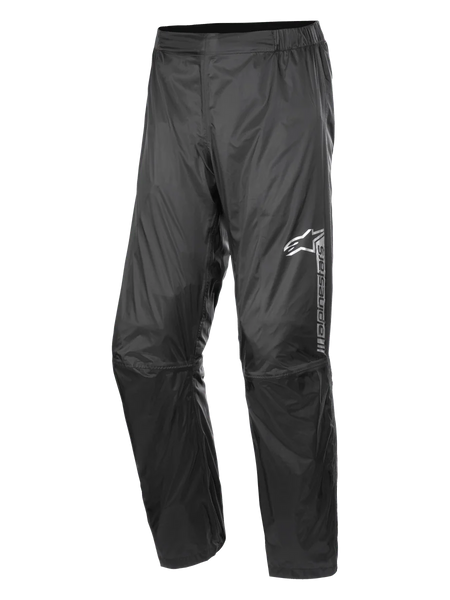 Alpinestars Hurricane Rain V2 Pant, Waterproof Motorcycle Rain Pants, Black, featuring reflective branding on the left thigh, elasticated waistband, ergonomic knee design, and shiny wind-resistant laminated fabric for road and adventure touring