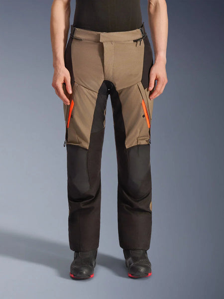 Alpinestars Andes V4 Drystar® Pants, Walnut and Black motorcycle adventure touring pants, featuring bright orange thigh zippers, reinforced black knee panels, and durable textile construction for all-weather riding.