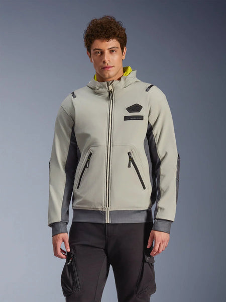 Alpinestars Moblast Waterproof Jacket, light gray and dark gray urban motorcycle hoodie with yellow hood lining, front pockets and black zippers, worn with black cargo pants, modern sporty design
