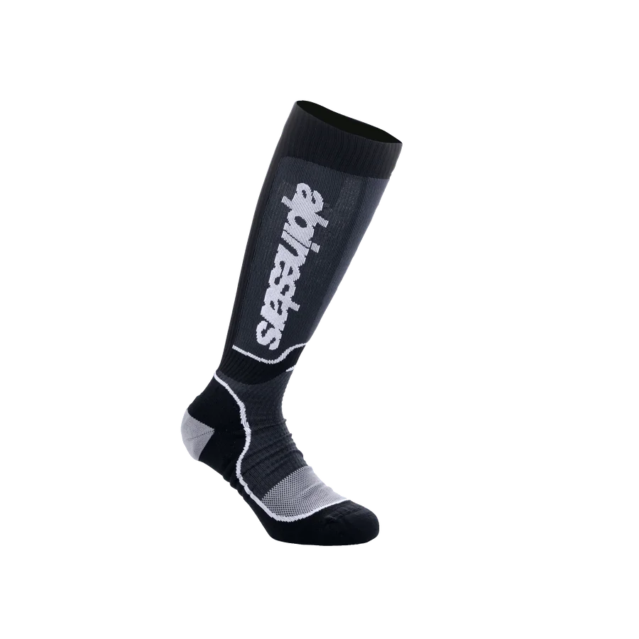 Alpinestars Youth MX Plus Socks, Motocross Knee-High Socks, Black and Gray, featuring white Alpinestars branding, ribbed texture with reinforced heel and toe, breathable single-layer construction for off-road performance