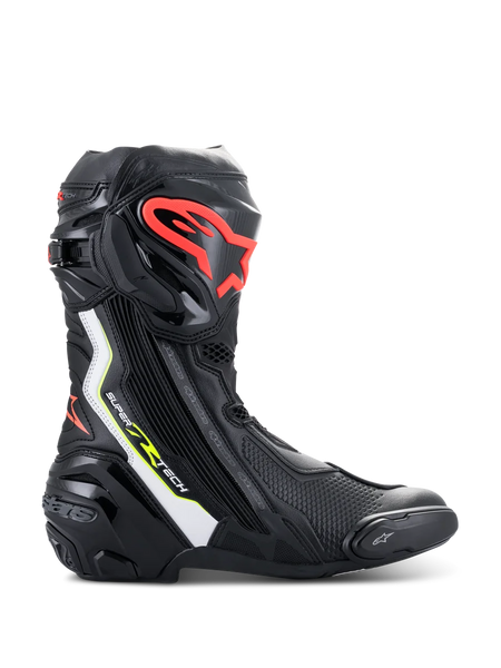 Alpinestars Supertech R Boots, high-performance motorcycle racing boots in black with white, red fluo, and yellow fluo accents, featuring a protective TPU shin plate with a red logo, replaceable toe slider, and sleek aerodynamic profile.