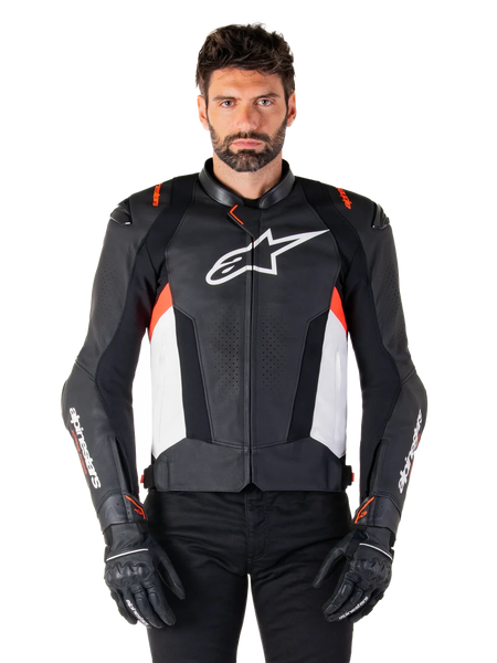 Alpinestars Missile V3 Leather Jacket, Black White and Red Fluo, premium racing sport jacket with bovine leather, featuring white chest logo and Alpinestars branding on sleeves, worn with black motorcycle gloves and pants