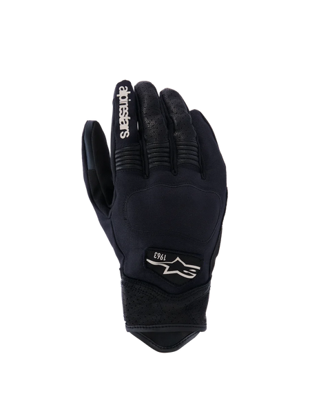 Alpinestars Tracker Gloves, Motorcycle Gloves, Black, backhand view showing stretch textile construction, perforated leather details on fingers and wrist, white branding on index finger, Alpinestars logo with 1963 on the back, padded knuckle area, short cuff urban design