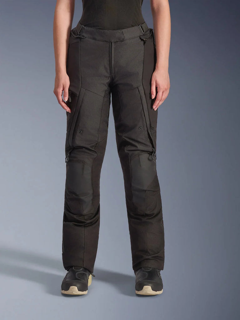 Alpinestars Stella Andes V4 Drystar Pants, Women's Adventure Touring Pants, Black, front view, featuring reinforced knee panels, water-resistant cargo pockets, and adjustable waist straps, worn with black boots in a studio setting.