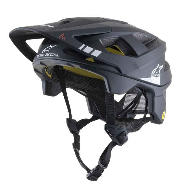 Alpinestars Vector Tech A1 MTB Helmet, Mountain Bike Helmet, Black and Light Gray Matt, white graphics and "ONE GOAL. ONE VISION." text, visible yellow MIPS inner lining, multiple ventilation openings, adjustable black straps with quick-release buckle, extended rear and side coverage, matte finish
