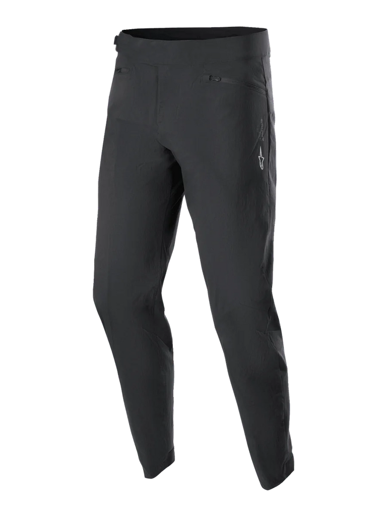 Alpinestars Youth A-Dura Pants, MTB Cycling Pants, Black, featuring two zippered front pockets and a small white Alpinestars logo on the left thigh, tapered leg design, durable stretch textile for youth mountain biking