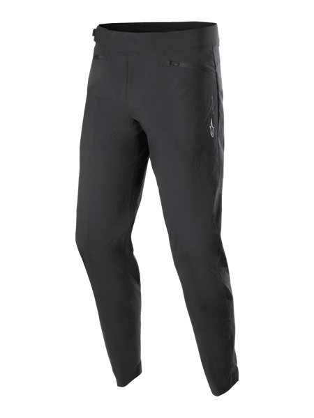 Alpinestars Youth A-Dura Pants, MTB Cycling Pants, Black, featuring two zippered front pockets and a small white Alpinestars logo on the left thigh, tapered leg design, durable stretch textile for youth mountain biking