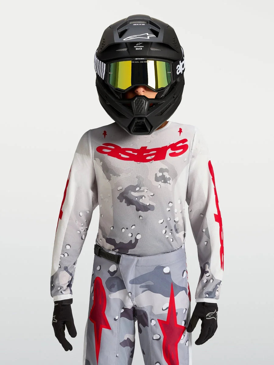 Alpinestars 2027 Youth Fluid Lone Jersey, gray camo and fire red motocross gear, performance textile construction.