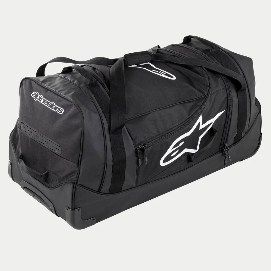 Alpinestars Komodo Travel Bag, large motocross gear bag in Black and Anthracite with white logos, featuring wheels and a telescopic handle, durable construction for racing equipment transport