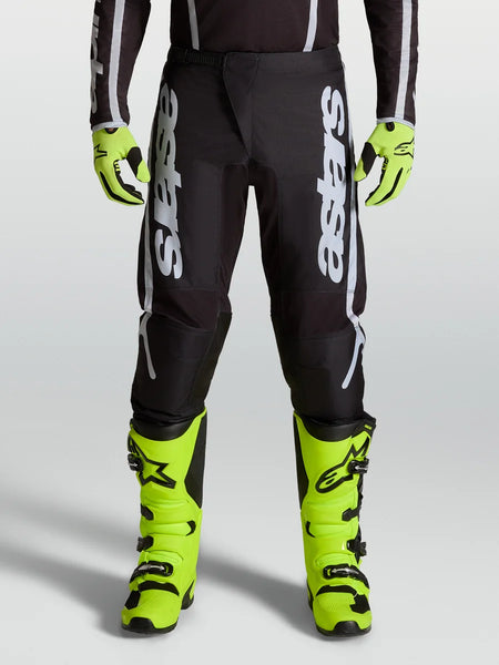 Alpinestars Fluid Apex V2 Pants, professional motocross performance pants in Black and Silver with ergonomic stretch panels.