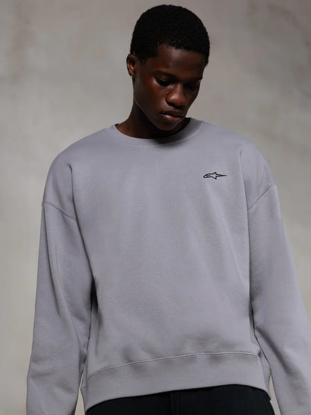 Alpinestars Essentials Ageless Crew, Silver premium crewneck sweatshirt, featuring a small black Alpinestars logo on the chest, worn by a model, casual lifestyle streetwear with a soft fleece texture.