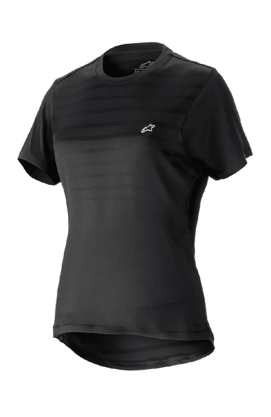 Alpinestars Women Stella Alps Constellation Jersey, Short Sleeve Mountain Bike Jersey, Black with subtle horizontal stripes on chest, small white logo, round neckline, extended tail for coverage, lightweight breathable fabric for MTB