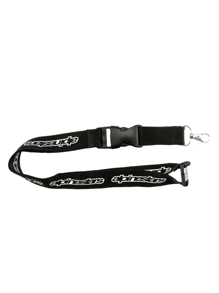 Alpinestars Core Lanyard, black sportswear lanyard featuring printed white brand logos, breakaway safety clip, and detachable metal swivel clip