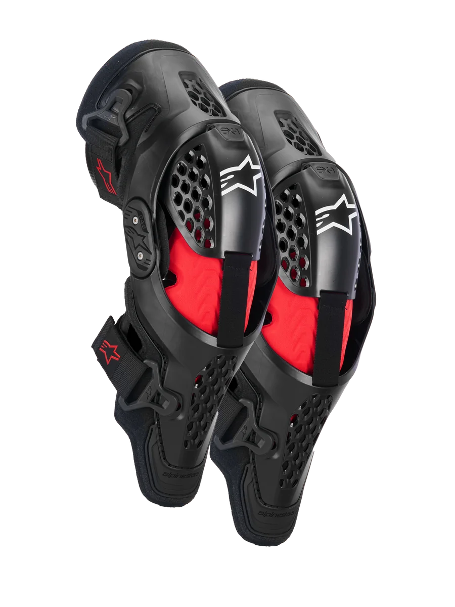 Alpinestars SX-1 Plasma Knee Protectors, Motocross Knee Protection, Black and Red, featuring semi-rigid ventilated frames, red inner padding, white Alpinestars logos on the kneecap, and a dual pivot hinge design for off-road performance