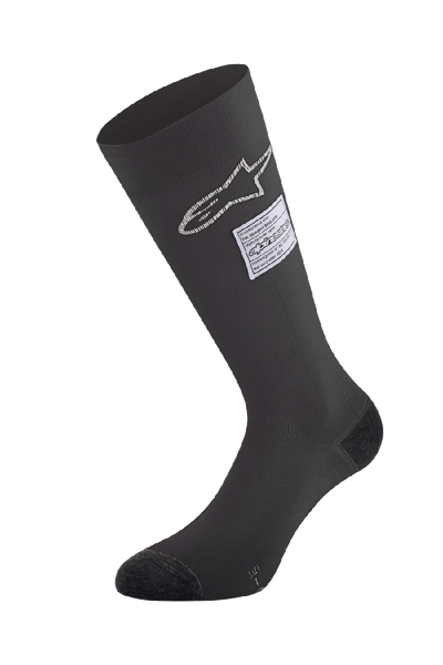 Alpinestars ZX V4 Socks, Black Auto Racing Socks, featuring white star logo and FIA certification label, knee-high seamless design with reinforced toe and heel, fire-retardant base layer for motorsport