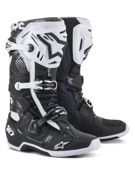 Alpinestars Tech 10 Motocross Boots, Black and White, high-performance protective design with white shin plates, black star logos, adjustable buckles, and DHCP heel protection, rugged textured soles for off-road racing