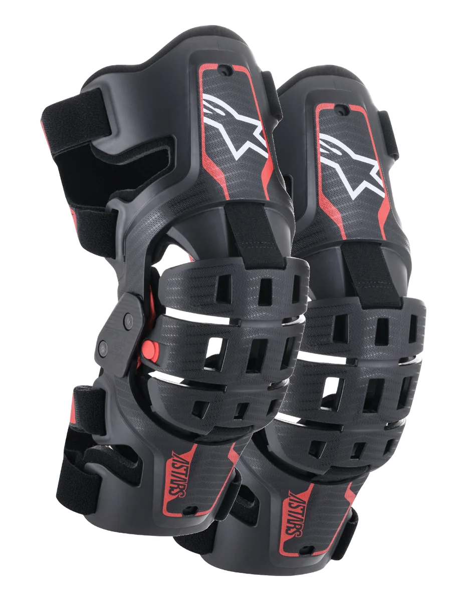 Alpinestars Youth Bionic 5S Knee Braces, Motocross Knee Protection, Black and Red, pair of protectors featuring a hybrid frame design with ventilated shells, white Astar logo on the upper section, red ASTARS branding on the lower section, and adjustable black straps for a secure fit.