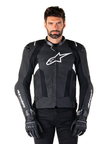 Alpinestars Missile V3 Leather Jacket, Black with White Logos, worn by a model with black riding gloves, premium leather motorcycle racing jacket with perforated ventilation panels and performance riding features