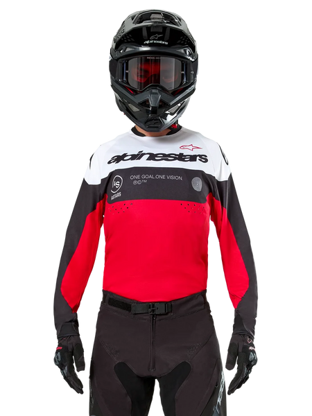 Alpinestars Pro-Dura Jersey, Motocross Jersey, Black Bright Red and White, worn with black helmet and goggles, sporty design with bold Alpinestars branding and laser perforations, performance enduro and off-road racing gear