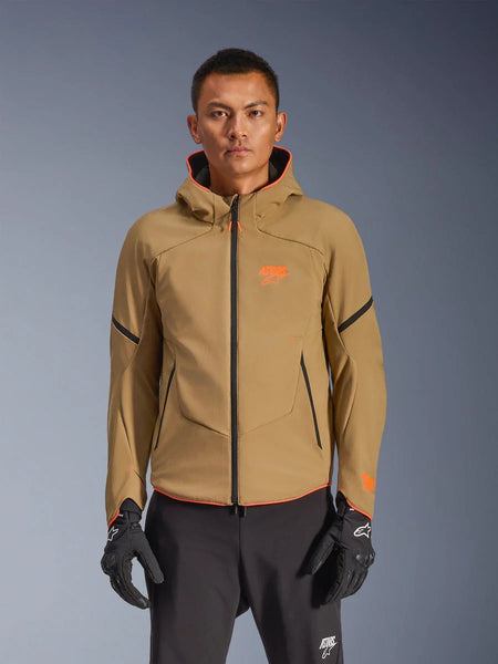 Alpinestars Aeroshell Waterproof Jacket, Dark Khaki hooded motorcycle jacket with orange logos and black zippers, black accent lines on sleeves, shown with black gloves and pants