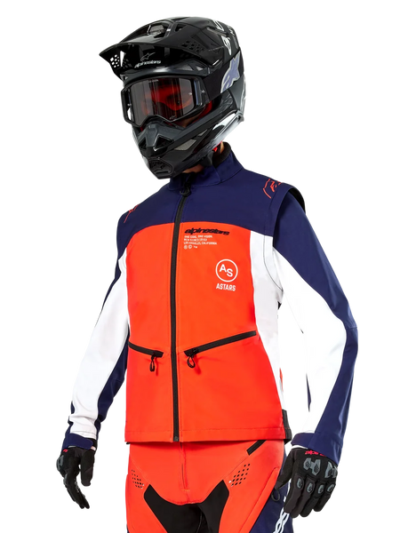 Alpinestars Lite-Dura Softshell Jacket in Navy, Hot Orange, and White, Motocross Gear, worn with black helmet and goggles, protective gloves, and matching racing pants