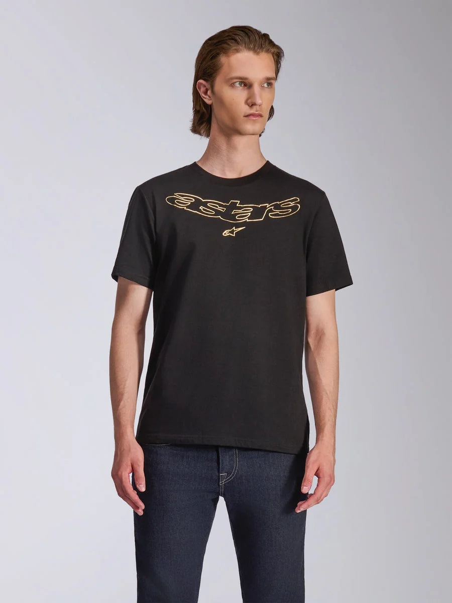 Alpinestars Luxo CSF Tee, Short Sleeve T-Shirt, Black, Gold Outlined Astars Logo on Chest, worn with dark blue jeans, Casual Motorsport Streetwear