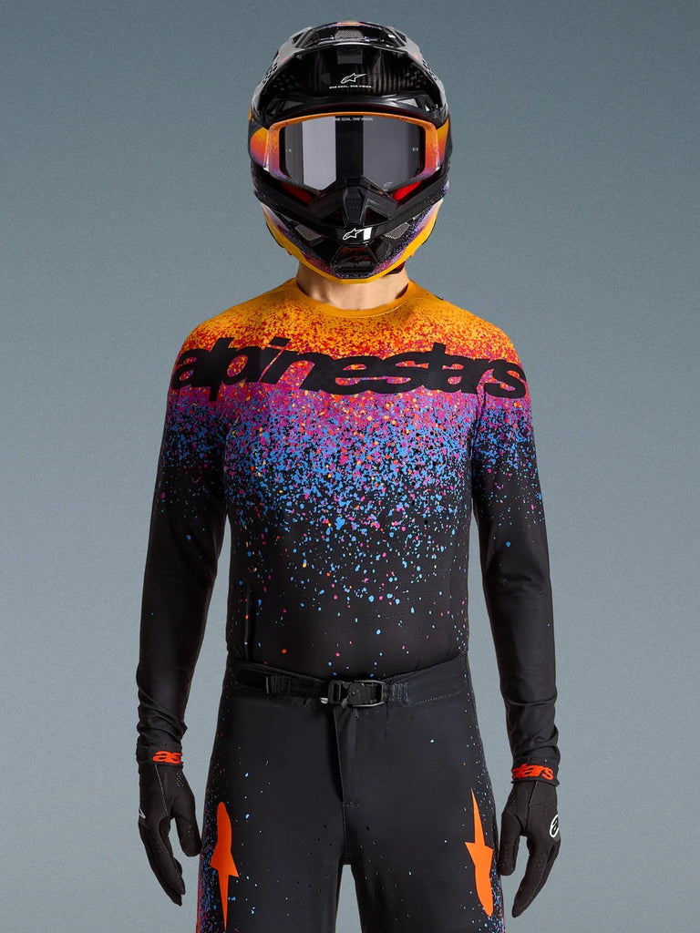 Alpinestars Limited Edition Supertech Black Hole Jersey, motocross racing jersey in black with vibrant orange and purple bursts.