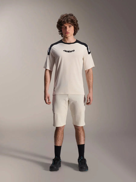 Alpinestars A-Aria Elite Shorts, Mountain Bike Shorts, Ecru, worn with matching short-sleeve jersey with black shoulder panels and logo, casual sporty look with front perforations, performance MTB apparel