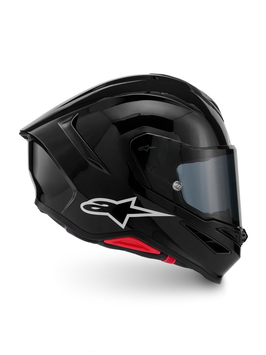 Alpinestars S-R7 Solid Helmet, Glossy Black motorcycle racing helmet with white Astar logo and ECE 06 certification, featuring advanced aerodynamics and lightweight carbon composite construction