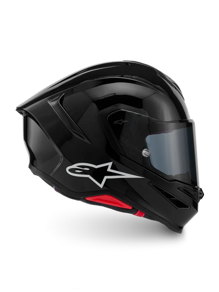 Alpinestars S-R7 Solid Helmet, Glossy Black motorcycle racing helmet with white Astar logo and ECE 06 certification, featuring advanced aerodynamics and lightweight carbon composite construction