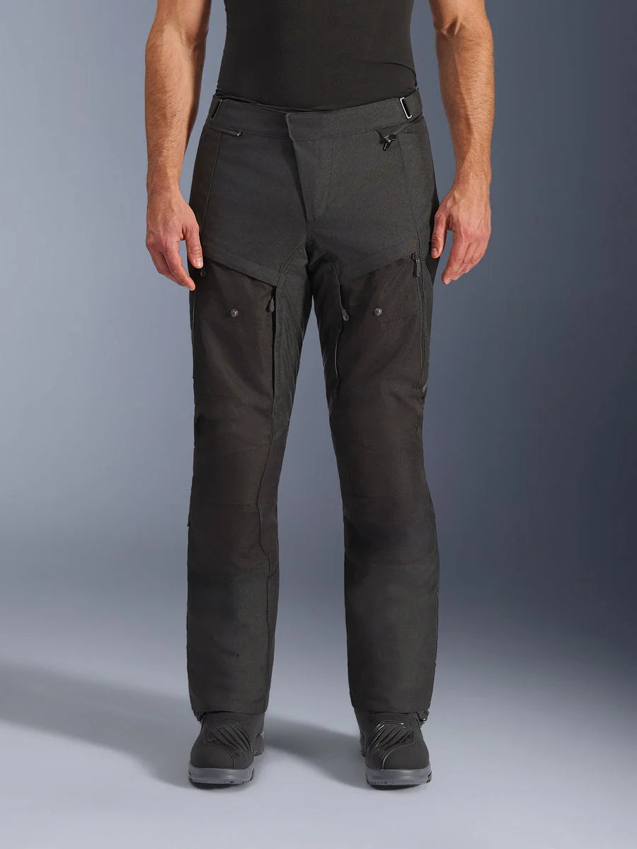 Alpinestars Cusco Drystar® Pants, Adventure Motorcycle Pants, Black, front view, featuring zippered thigh ventilation and adjustable waist, durable ripstop and 600D textile construction, worn with black boots