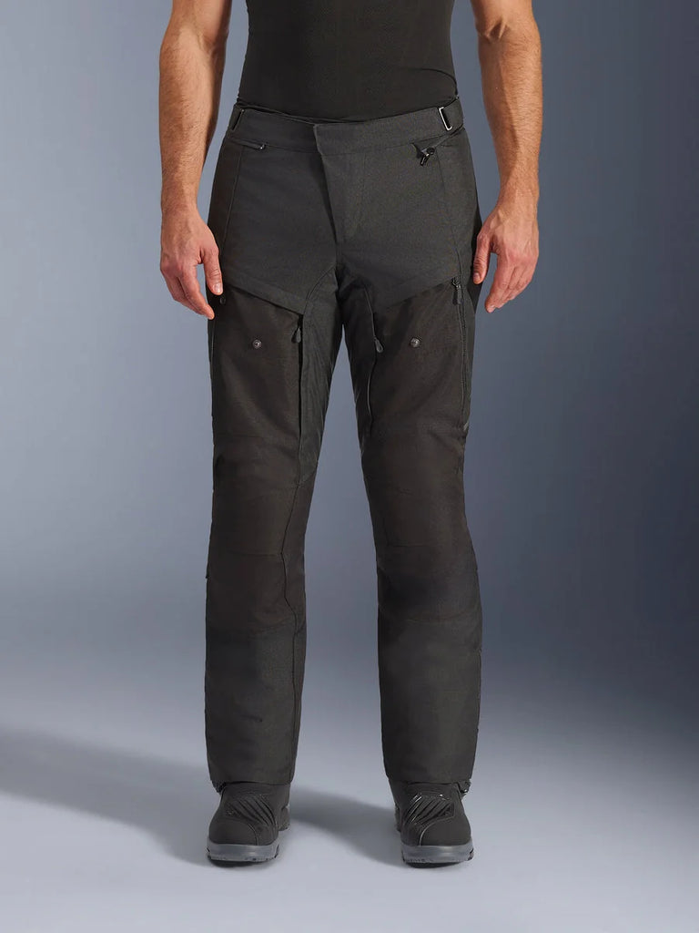 Alpinestars Cusco Drystar® Pants, Adventure Motorcycle Pants, Black, front view, featuring zippered thigh ventilation and adjustable waist, durable ripstop and 600D textile construction, worn with black boots