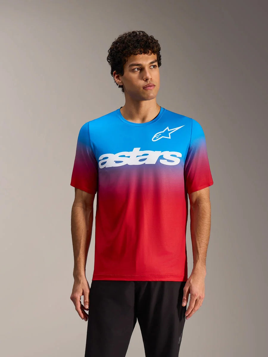 Bright red blue A-Dura ASTARS 2.0 MTB Jersey with a gradient design and bold white logos on a male model.