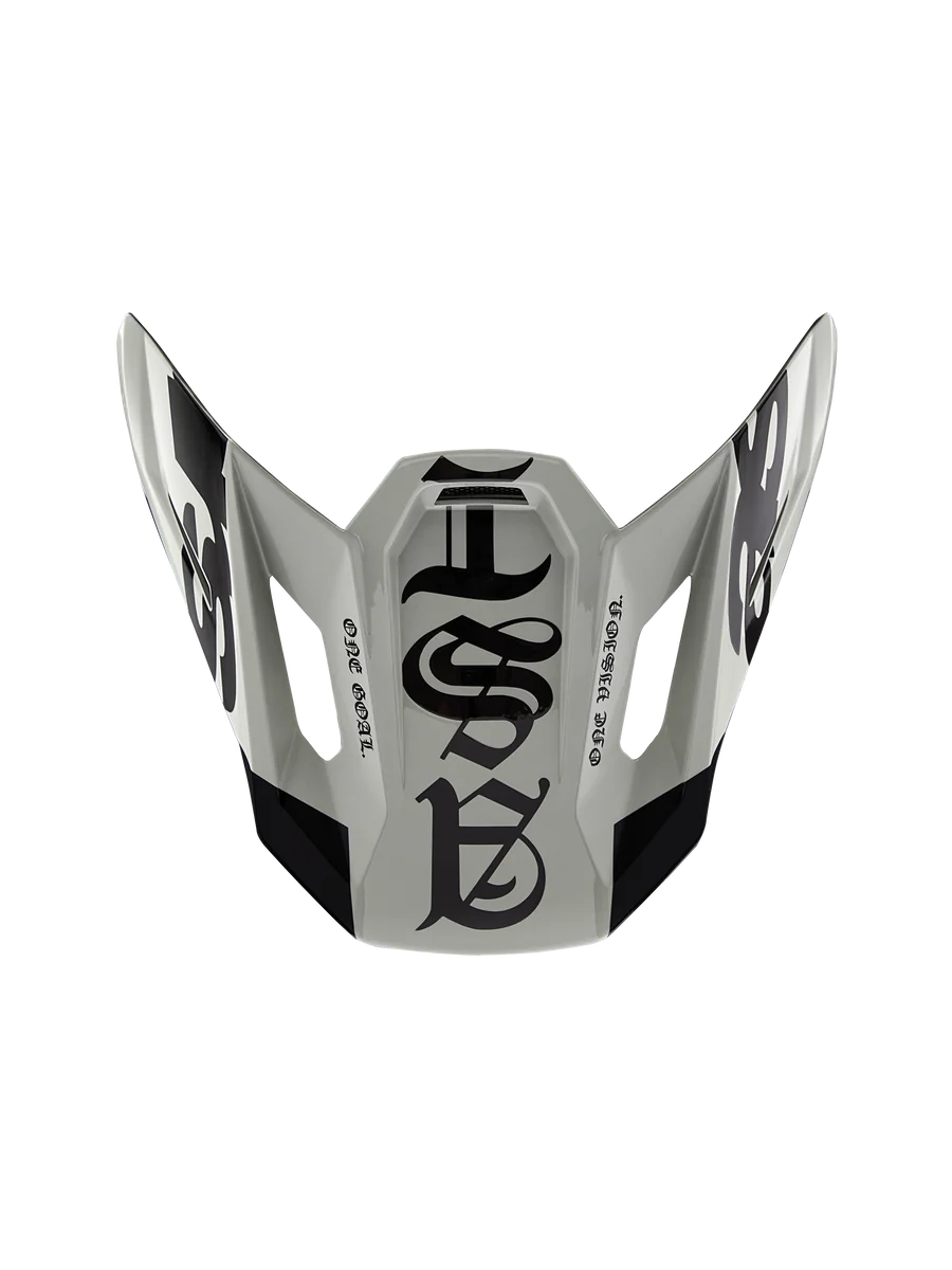 Alpinestars Limited Edition S-M7 Wolf Dust Visor 22.06, Motocross Helmet Replacement Peak, Dune and Black Glossy, featuring gothic-style graphics and 'ONE GOAL' 'ONE VISION' text, aerodynamic design for off-road racing